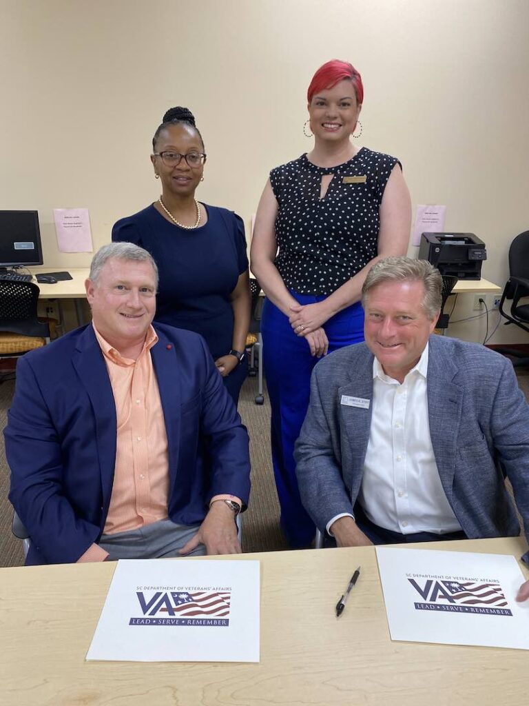 Goodwill of Middle Georgia President James Stiff and South Carolina Department of Veteran Affairs Director of Operations David Rozelle sign the MOU