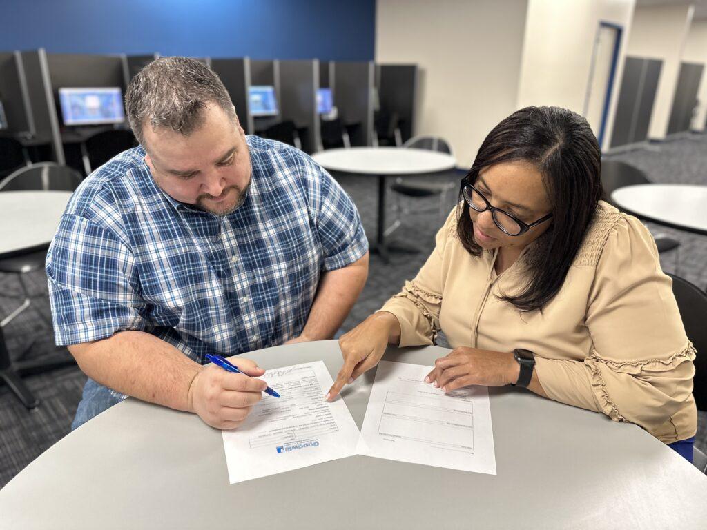 Job seeker meeting with Goodwill of Middle GA career coach.