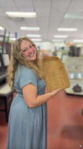 Shopper holds thrifted basket at Goodwill in Augusta, Georgia.